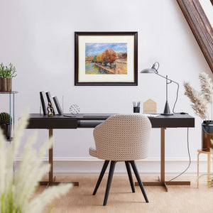 ARTualize is the only art gallery in Singapore that lets you rent paintings for your home.  This is an image of a modern study room with a writing desk  and a comfortable chair with a beautiful oil on paper painting of Paris on the wall. 